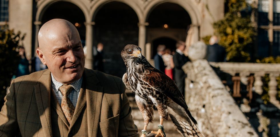 Man with bird on hand 