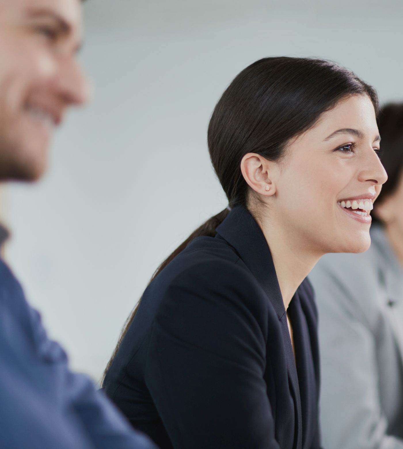 Woman smiles at corporate venue