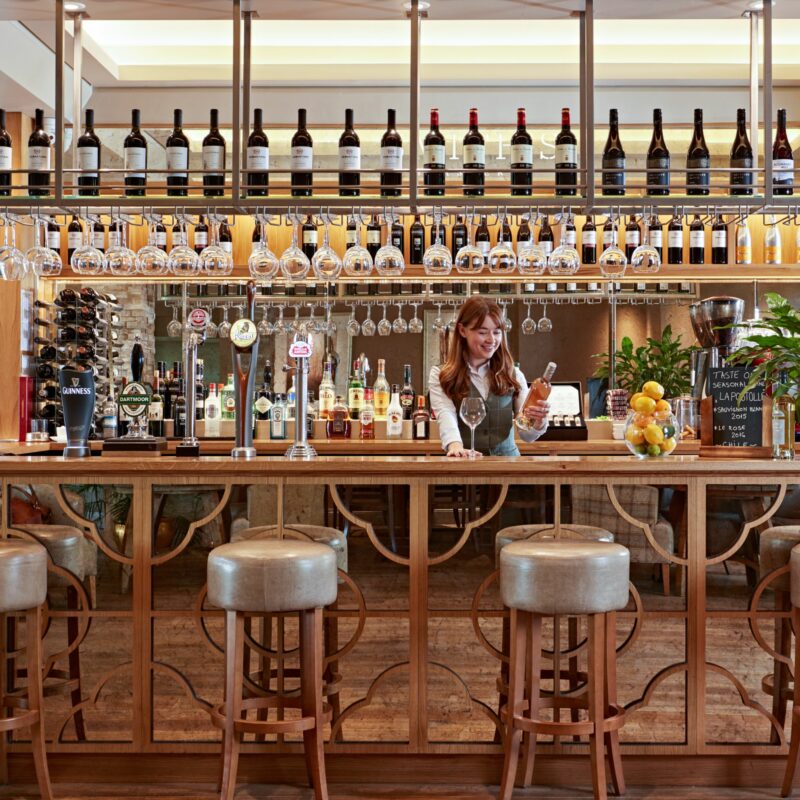 bartender smiling behind bar