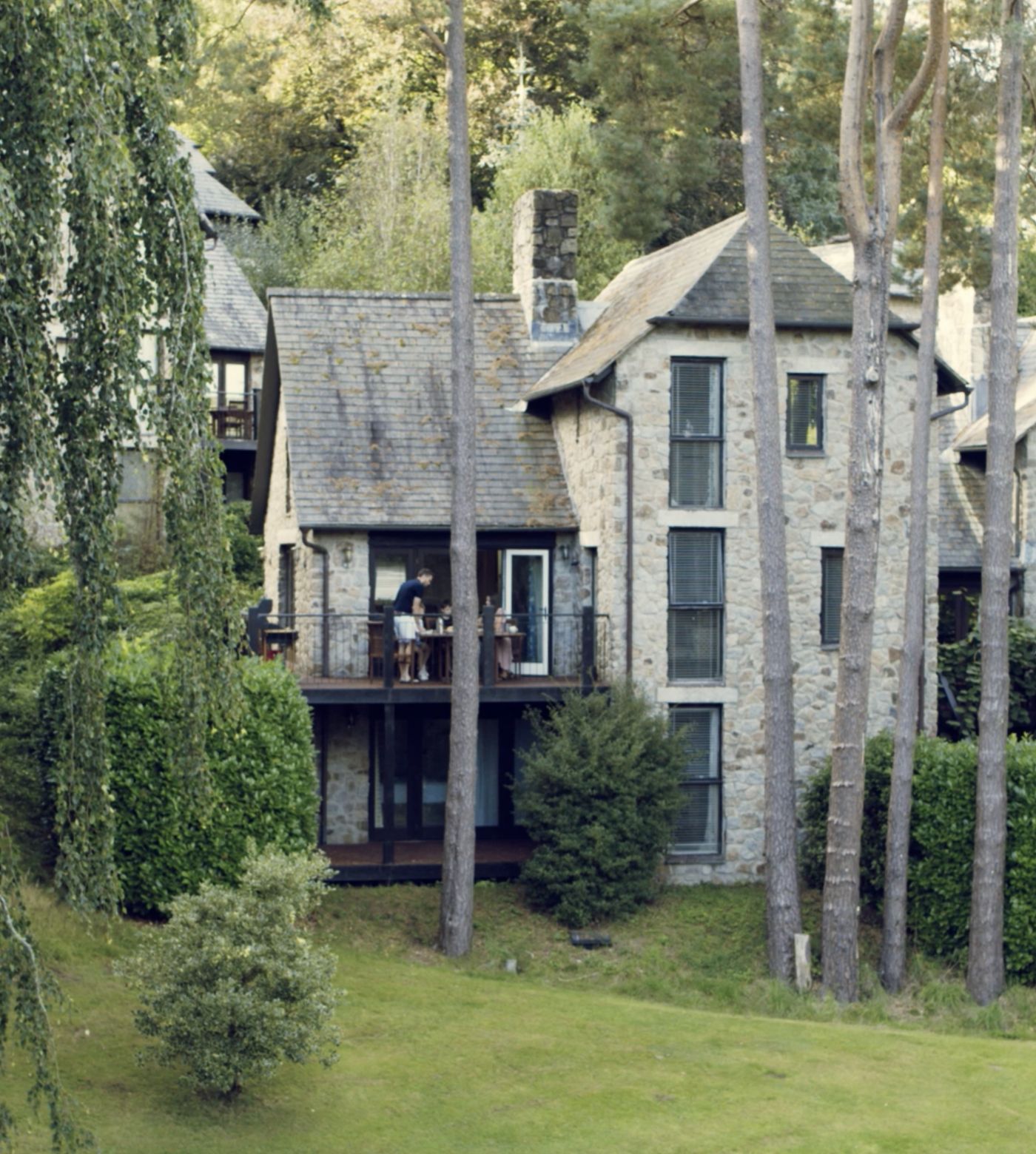 Family lodge exterior and surrounding greenery 