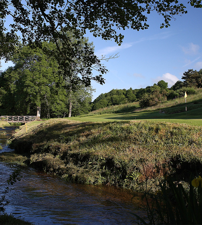 birds eye view of bovey golf course with castle in background 