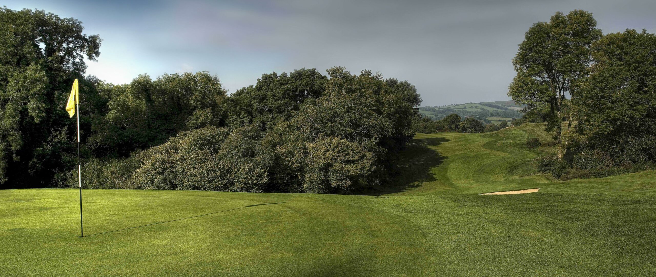 Golf course green with flag 