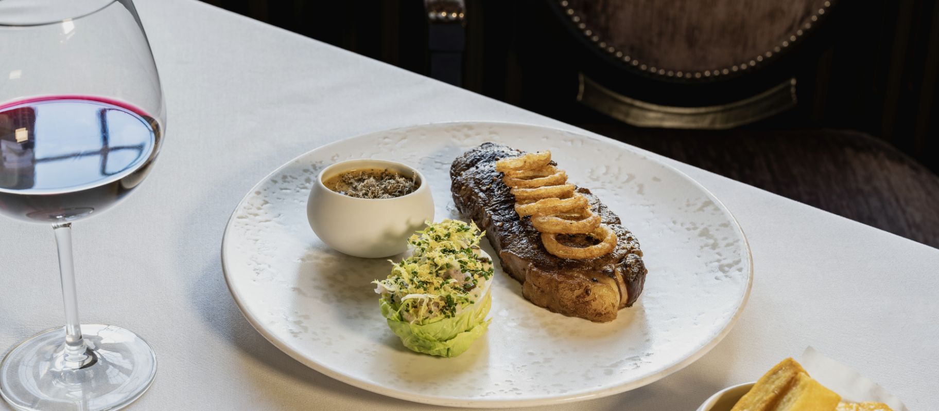 Plate of food with glass of wine 