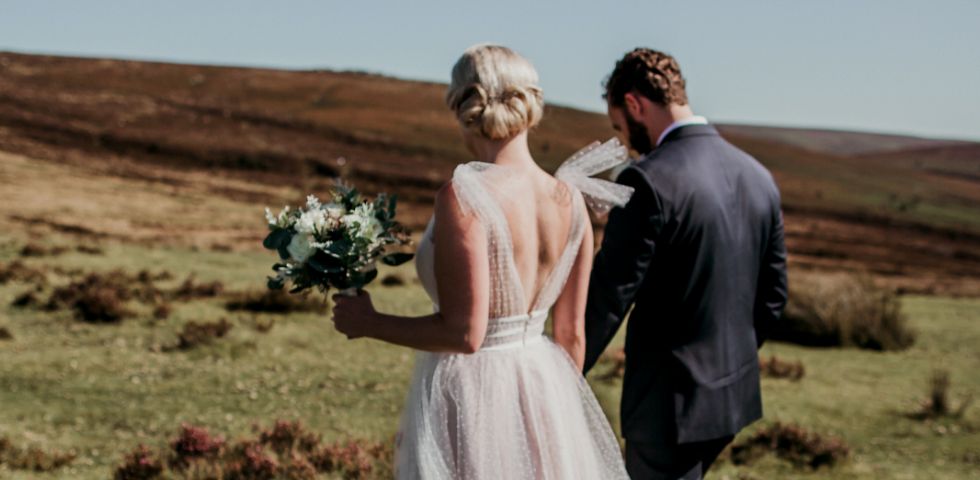 Married couple walking hand in hand 