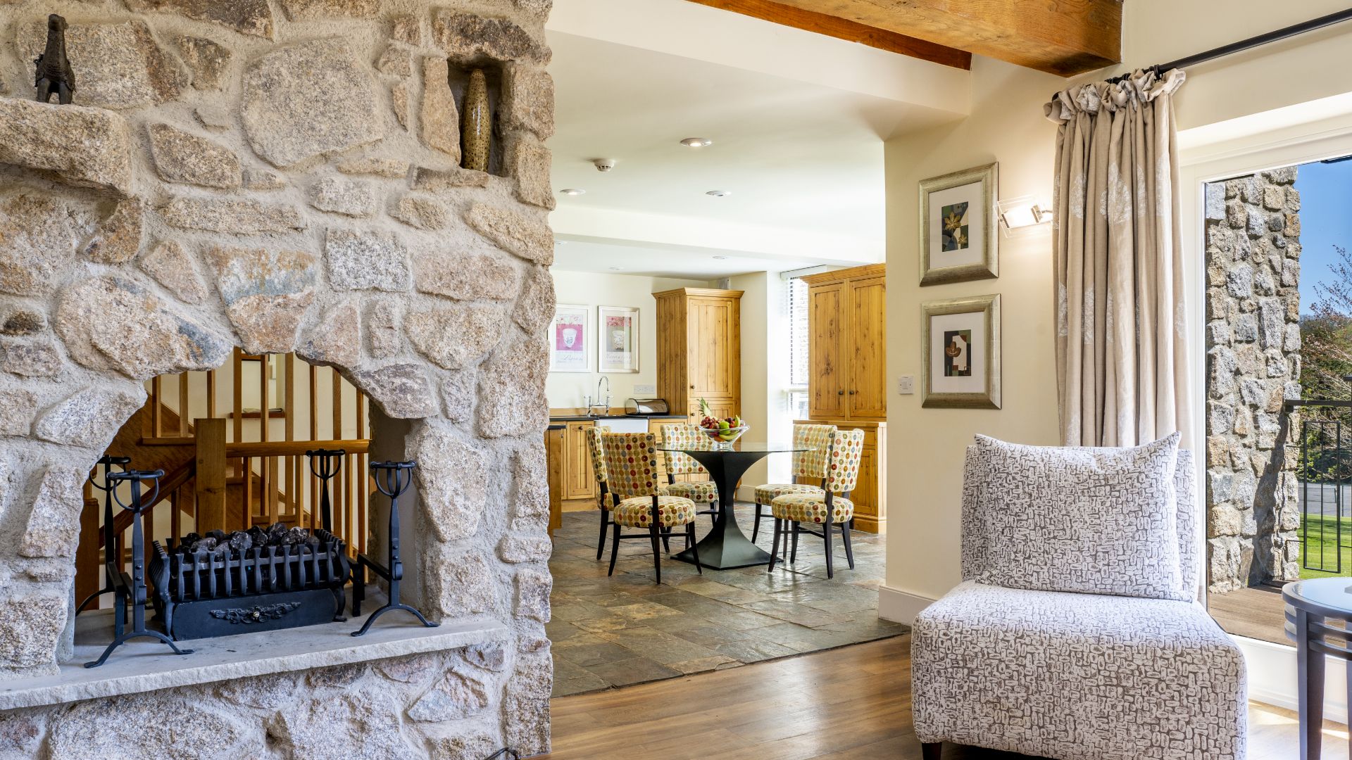 Interior of lodge with fireplace and armchair 