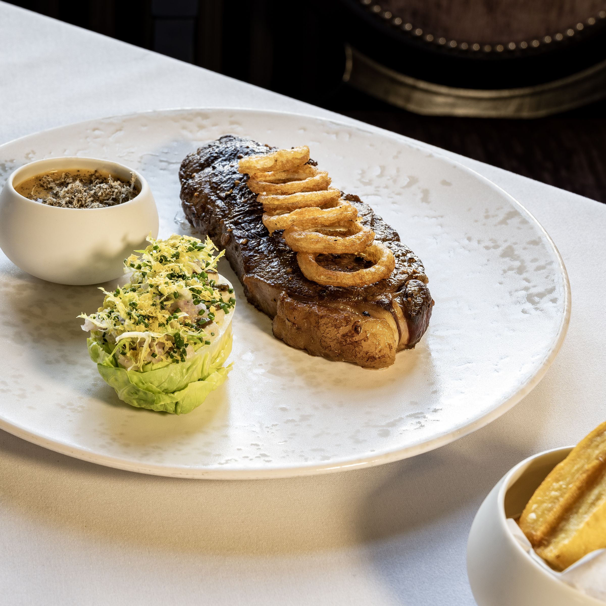 steak and side dishes on plate 