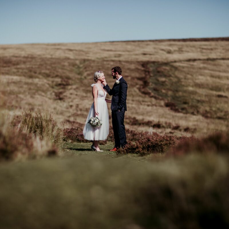 married couple on hilltop