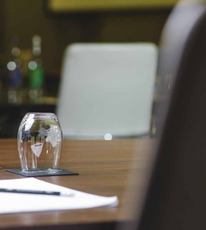 empty glass upside down on corporate table 